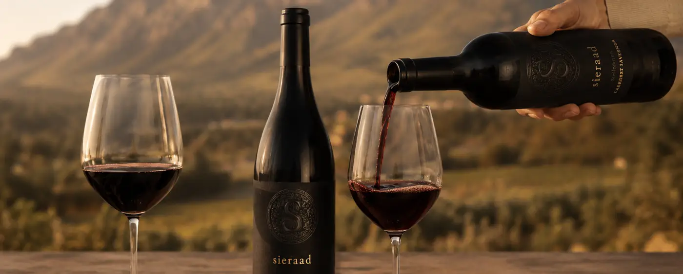 A bottle of Sieraad on a candlelit table