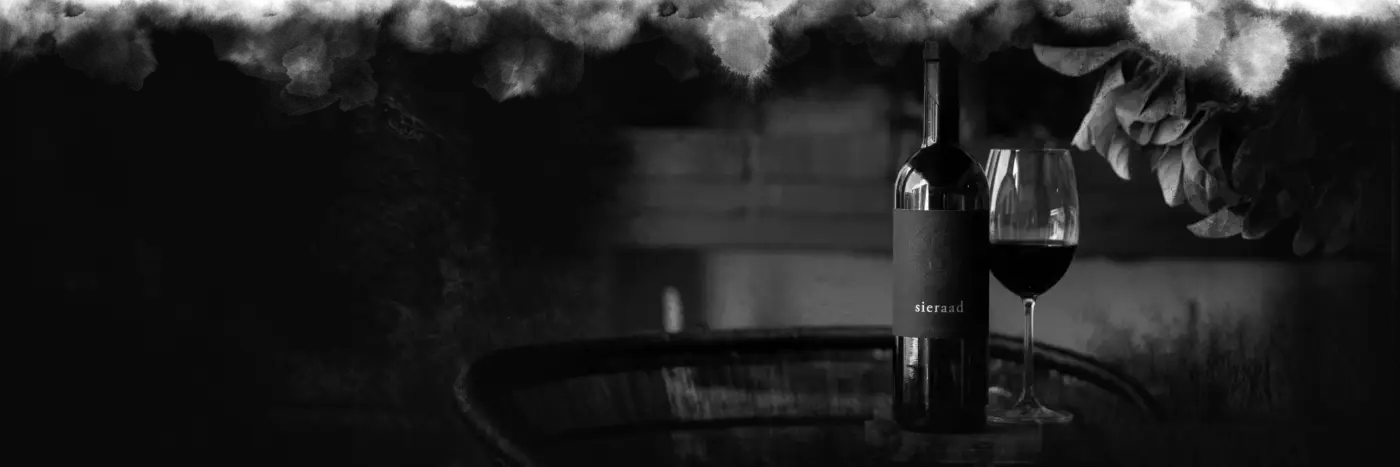 A glass of Sieraad being poured in the cellar